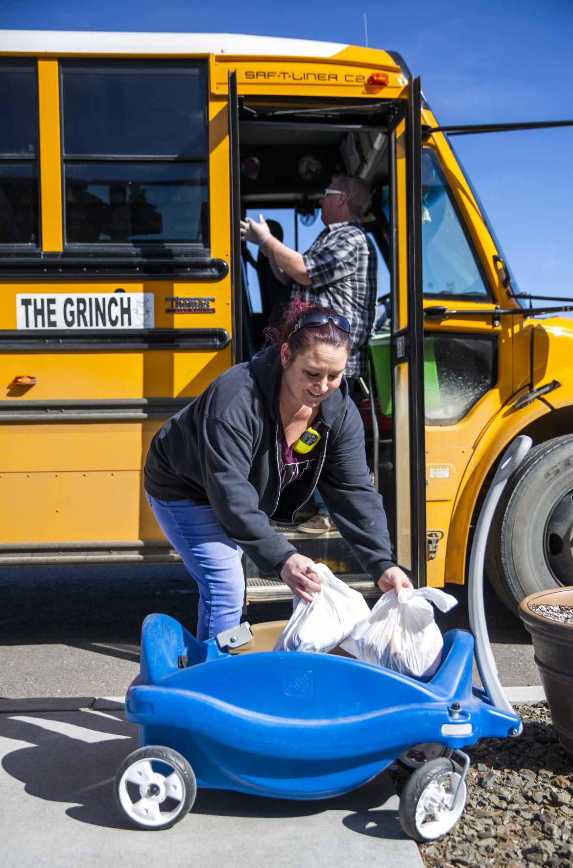 Bus drivers deliver food to students